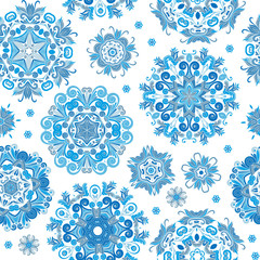 Floral seamless pattern with stylized snowflakes. Blue snowflake on white background.