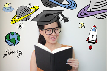 Young Asian woman holding book, wearing graduation hat with stars and space  illustrator doodles -...