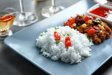 Chili Con Carne with rice on plate, close up