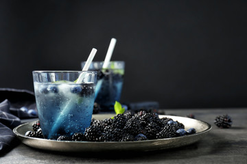 Composition with delicious ripe blackberries on table