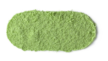 Ellipse made of natural wheat grass powder on white background