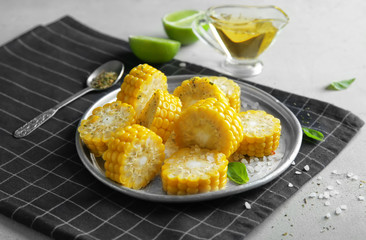 Tasty corn cobs on plate