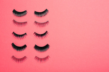 Different false eyelashes on color background