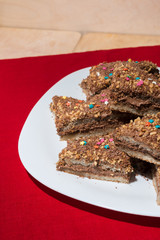 Cakes with a colorful sprinkling of stars on a white plate