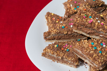 Cakes with a colorful sprinkling of stars on a white plate