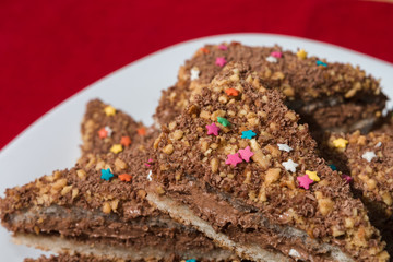 Cakes with a colorful sprinkling of stars on a white plate