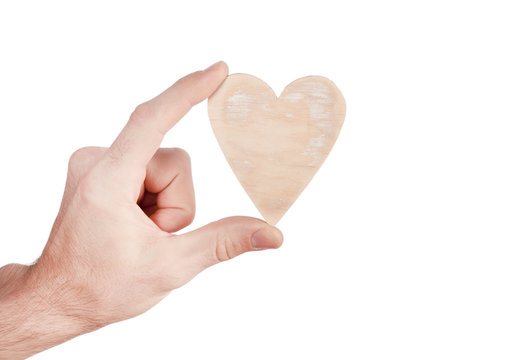 Wood heart in hand