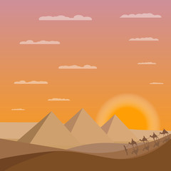 Fototapeta na wymiar Caravan of camels near Egypt pyramids. Egypt sands with pyramids and sunset