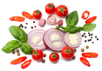 mix of slice of tomato, red onion, basil leaf, garlic and spices isolated on white background. top view