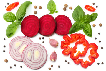 mix of slice of beetroot, red onion, basil leaf, garlic, sweet bell pepper and spices isolated on white background. top view