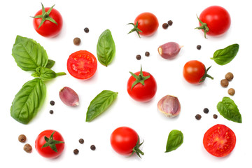 mix of slice of tomato, basil leaf, garlic and spices isolated on white background. top view