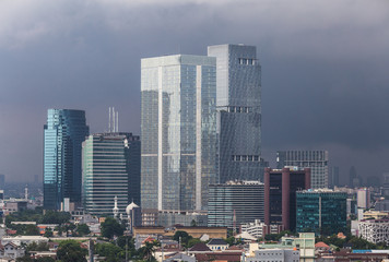 Fototapeta na wymiar Tropical storm coming over Jakarta business district in Indonesia.