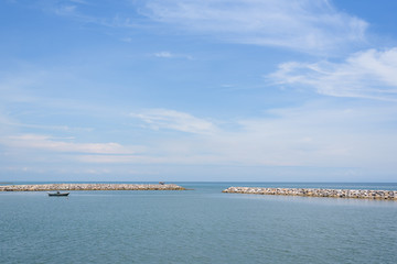 Calm blue ocean with rock, no wave and blue sky