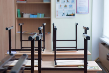 Look out from the table, blur image of empty classroom as background