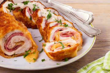 Chicken breasts with cheese and bacon. Crispy, creamy chicken wraps, horizontal