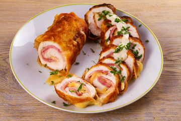 Chicken breasts with cheese and bacon. Crispy, creamy chicken wraps, horizontal