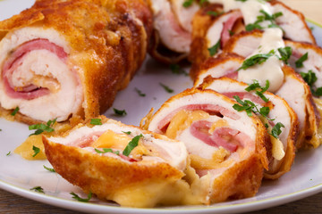Chicken breasts with cheese and bacon. Crispy, creamy chicken wraps, horizontal