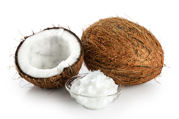 Coconut and bowl with coconut oil isolated on white background.