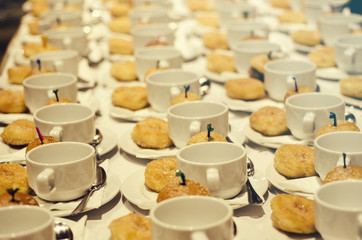 Coffee break at conference meeting for seminar.Doughnut,Hamburger and white cup of coffee.Concept for blur background.