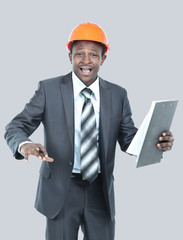 Portrait of happy smiling business man in helmet