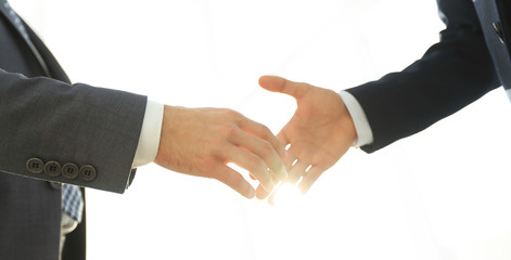 Two  business men going to make handshake