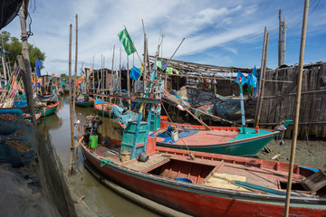 Naklejka na ściany i meble Thai small fishing boats have docked at fishing village at day time