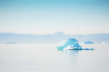 Fototapeta na wymiar Blue icebergs in the Ilulissat icefjord, Greenland
