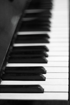 Piano keyboard background with selective focus. Black and white color image .