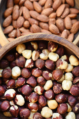 hazelnut and almond in wooden bowl for background