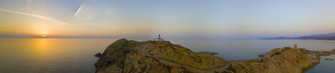 Fototapeta na wymiar Vista aerea del Faro della Pietra al tramonto e della torre genovese, L’Ile-Rousse, Isola Rossa Corsica, Corsica, Francia 