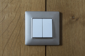 switch on a wood-covered wall