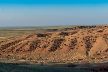 Panoramic view of picturesque landscape with plants on hills 
