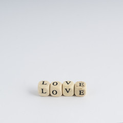 formation of the word Love with nuts containing the letters