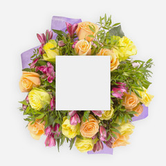 Creative layout with colorful flowers, leaves and copy space card note. Flat lay.