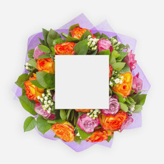 Creative layout with colorful flowers, leaves and copy space card note. Flat lay.