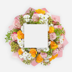 Creative layout with colorful flowers, leaves and copy space card note. Flat lay.