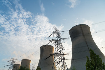 a row of cooling tower at dusk