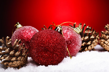 Christmas composition of Christmas tree toys on a red background