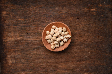 close up of garbanzo beans in wooden bowl 