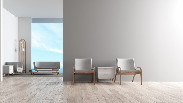Modern interior living room wood floor with sofa set. wating chair in front of living room sea view summer 3d rendering