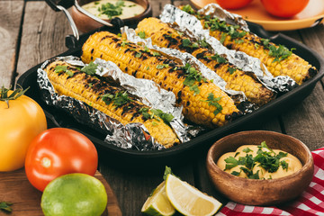 grilled corn covered in foil