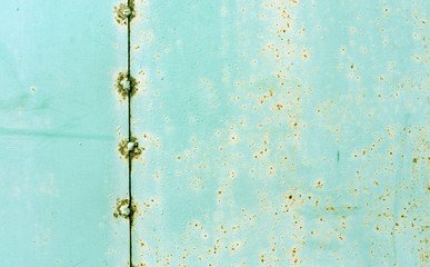 Rusty metal plate with welding.