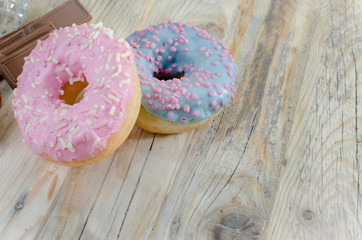 Strawberries on the table. Red strawberries on a wooden table in a glass vase. chocolate and soft buns.
