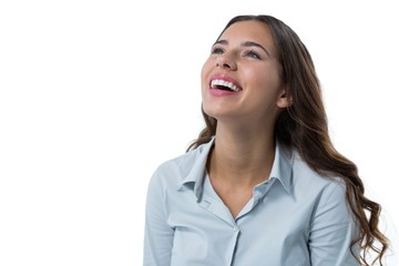 Female executive smiling against white background