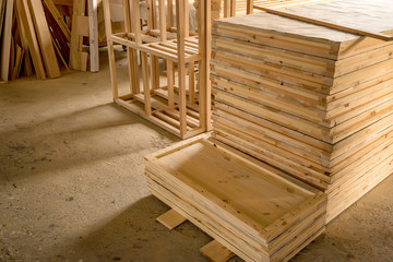 Inside woodworking workshop with lumber in front