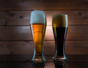 Two glasses of different colored beer