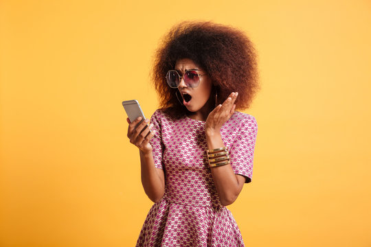 Portrait of a shocked surprised afro american woman