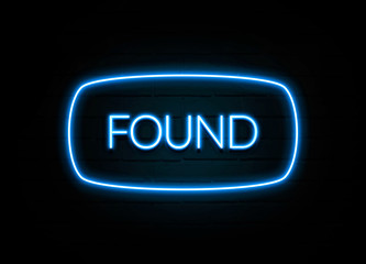 Found  - colorful Neon Sign on brickwall