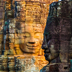 Stone murals and statue Bayon Temple Angkor Thom. Angkor Wat the largest religious monument in the...