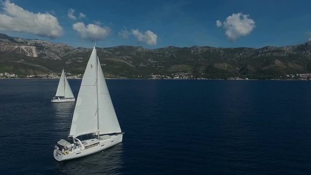 Aero shooting of two yachts in the open sea